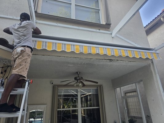 Awning instalation at pool area - This is a Awning instalation at the customers pool area. they wanted a 10 ft retractable Awning. which was sourced and installed by us.