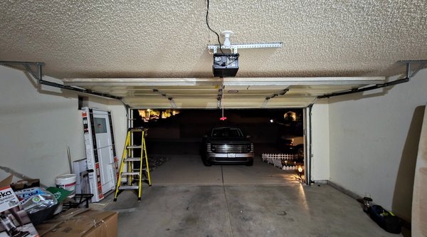 Emergency Repair - Responded to an emergency off-track garage door that had bent panels and was hanging dangerously over the customer’s vehicle, creating a serious safety hazard. Safely secured the door, corrected the off-track condition, realigned tracks, and restored proper door travel. Inspected rollers, hinges, cables, and hardware for damage, made necessary adjustments, and verified smooth, safe operation. Completed full safety testing before returning the garage door to service. Emergency Repair - Responded to an emergency off-track garage door that had bent panels and was hanging dangerously over the customer’s vehicle, creating a serious safety hazard. Safely secured the door, corrected the off-track condition, realigned tracks, and restored proper door travel. Inspected rollers, hinges, cables, and hardware for damage, made necessary adjustments, and verified smooth, safe operation. Completed full safety testing before returning the garage door to service.