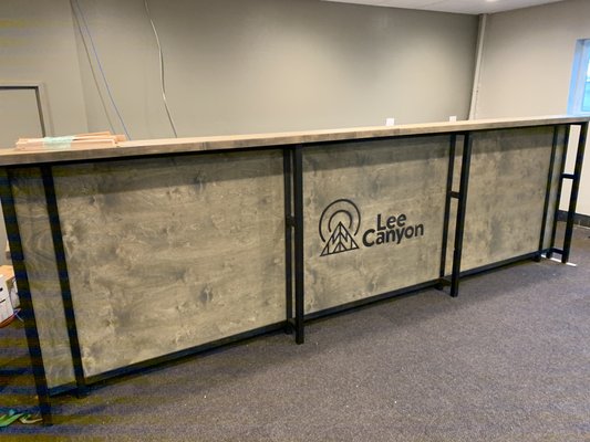 Lee Canyon - Reception Counter & Signs - In addition to making 40 tables for Lee Canyon, we also built the 15' front counter and a number of wood and metals signs. Lee Canyon - Reception Counter & Signs - In addition to making 40 tables for Lee Canyon, we also built the 15' front counter and a number of wood and metals signs.