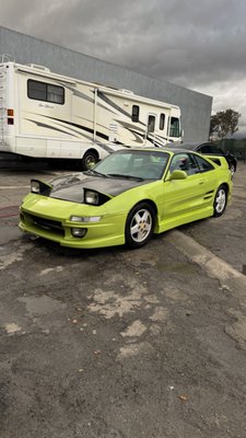 Toyota MR2 Makeover - We restored this Toyota MR2 by repairing its damaged body panels and reviving it with a stunning green paint job. Now, it’s back to life, turning heads with its fresh, classic look! Toyota MR2 Makeover - We restored this Toyota MR2 by repairing its damaged body panels and reviving it with a stunning green paint job. Now, it’s back to life, turning heads with its fresh, classic look!