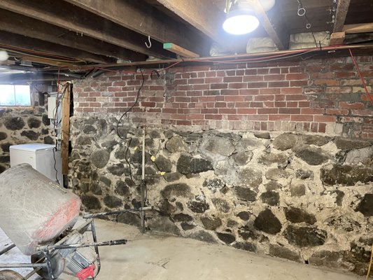 Stone foundation restoration - Stone foundation restoration with complete interior stone pointing, brick repairs and waterproof sealant. Turn crumbling stone walls into new dry, secure waterproof structures.