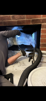 Chimney Cleaning Overdue - Here is a picture of Ben at work. He is cleaning the chimney and look at all that dangerous black soot that he is removing. This is the stuff that can start a serious chimney fire. Good job on the customer for having us clean this for them.