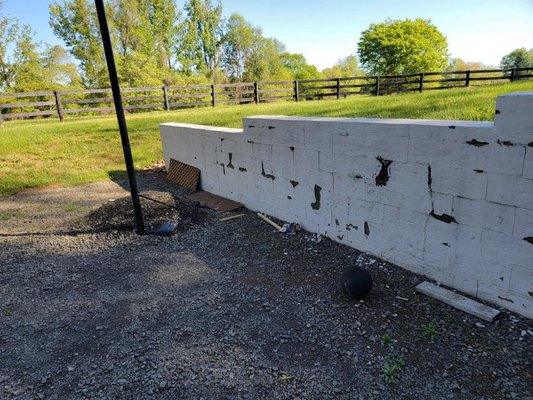 Retaining Wall Repair and Restoration - A 30 year old retaining wall made to look like new.