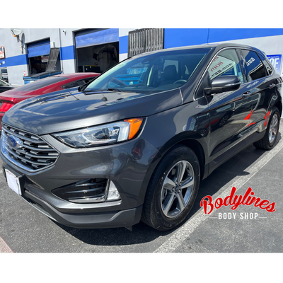 2020 Forde Edge - This Ford Edge had damage to the entire left side as well as the rear suspension. We replaced the front left fender, front door and rear suspension. The rear door and quarter panel were repaired.
