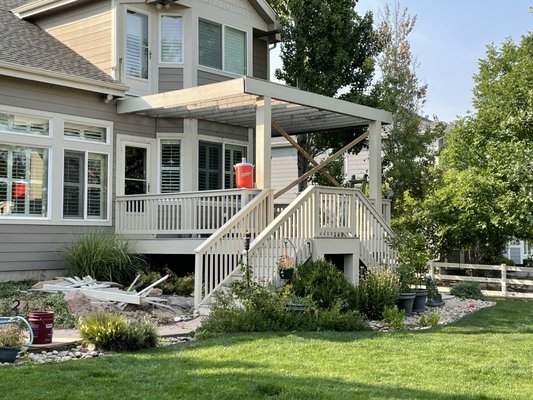 Triple level Deck with waterfall stairs - This customer wanted her deck replaced and expanded to include an additional level for cooking and sitting. She also had an unusual request for a ‘waterfall’ or cascading steps. She loved it when it was done!