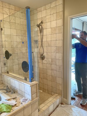 Shower Remodel - Removed old framed shower glass and replaced with new frameless hardware. Shower Remodel - Removed old framed shower glass and replaced with new frameless hardware.