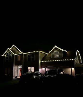 Warm White Perfection - Beautiful holiday lighting by Evergreen Holiday Lighting. This home features a clean and modern roofline design that highlights the architecture with a warm, inviting glow. Every light was installed with precision and care to create a balanced, elegant look that shines all season long. Warm White Perfection - Beautiful holiday lighting by Evergreen Holiday Lighting. This home features a clean and modern roofline design that highlights the architecture with a warm, inviting glow. Every light was installed with precision and care to create a balanced, elegant look that shines all season long.