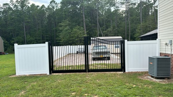 Aluminum Estate Gate - An Aluminum Gate installed with a 6ft High White Vinyl Privacy Fence. Aluminum Estate Gate - An Aluminum Gate installed with a 6ft High White Vinyl Privacy Fence.
