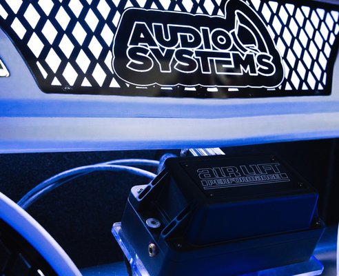 ABOUT US - SINCE WE OPENED IN 2000,
Our Customers Always Get The Best Install Quality The Best Service
Audio Systems came from humble beginnings when Javier Sr. started the business doing car stereo installs in the parking lot of a local swap meet, where we had our first 4' by 8' indoor store. It wasn't much, but our reputation for having great prices, doing great installs, and providing great service spread quickly and we were able to move into a real location with multiple install bays in 2009. Our business kept growing and in 2014 we had three locations and were the go-to place for custom car audio in Perris, Moreno Valley, and the surrounding areas. Unfortunately in 2014, Javier was diagnosed with cancer and needed to take some time away from the business, turning over the operation to his son, Javier Jr., and leading to the company downsizing.

While we may have lessened the amount of locations, we certainly didn't stop providing Southern California with some of the best car stereo systems in the country. In 2019, one of our show cars won state finals and another came in 3rd place for world finals. We have been honored to receive some of the industry’s top awards, such as being one of the largest volume car audio stores in the country and having some of the top recognized salespeople and installers as measured by Mobile Electronics Magazine. We are proud to have relocated to Montclair in September of 2020 with a brand-new shop, and we have a lot of big stuff lined up. Whether you need a simple stereo installed or are looking for the coolest custom fabricated show car, know that our team at Audio Systems is still providing great prices, great installs, and great service. We look forward to working with you!