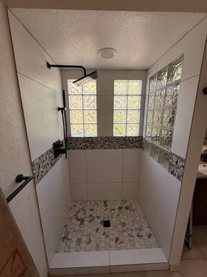 Frameless Glass shower door installation - Just finished installing this custom frameless glass shower door. The matte black hardware and clean glass lines really make that hexagon tile and glass block detail pop.
What was done:
• Precision-fit frameless glass installation.
• Matte black hardware mounting and leveling.
• Professional waterproofing and seal check.
Ready to ditch the shower curtain for something more modern? Message me for a quote on your next bathroom project! Frameless Glass shower door installation - Just finished installing this custom frameless glass shower door. The matte black hardware and clean glass lines really make that hexagon tile and glass block detail pop.
What was done:
• Precision-fit frameless glass installation.
• Matte black hardware mounting and leveling.
• Professional waterproofing and seal check.
Ready to ditch the shower curtain for something more modern? Message me for a quote on your next bathroom project!
