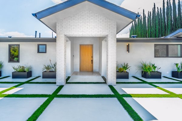 Sleek Exterior Revamp in Woodland Hills, CA - Elevate your home's curb appeal effortlessly with this inspiring exterior remodel by Build Trust Remodeling. In the heart of Woodland Hills, CA, we transformed a dated facade into a contemporary masterpiece. This exterior upgrade features a premium smooth stucco finish, delivering a clean, modern look while enhancing the home’s curb appeal and durability. Our team removed the existing textured surface, applied multiple coats of high-quality cement plaster, and meticulously hand-floated the finish for a flawless, uniform appearance. The result is a sleek, contemporary façade that’s not only visually striking but also built to withstand the elements for years to come. We also installed precision-laid pavers that create a welcoming entrance pathway, incorporating eco-friendly materials like low-maintenance artificial turf strips and sleek black planters to blend style with functionality, promoting a healthier outdoor space for your family. Completed with minimal disruption, this project boosts property value while ensuring affordability—proving you can achieve superior results without overpaying. Services include: Exterior Stucco Application, Paver Installation, Landscaping Integration, and Modern Facade Design. Sleek Exterior Revamp in Woodland Hills, CA - Elevate your home's curb appeal effortlessly with this inspiring exterior remodel by Build Trust Remodeling. In the heart of Woodland Hills, CA, we transformed a dated facade into a contemporary masterpiece. This exterior upgrade features a premium smooth stucco finish, delivering a clean, modern look while enhancing the home’s curb appeal and durability. Our team removed the existing textured surface, applied multiple coats of high-quality cement plaster, and meticulously hand-floated the finish for a flawless, uniform appearance. The result is a sleek, contemporary façade that’s not only visually striking but also built to withstand the elements for years to come. We also installed precision-laid pavers that create a welcoming entrance pathway, incorporating eco-friendly materials like low-maintenance artificial turf strips and sleek black planters to blend style with functionality, promoting a healthier outdoor space for your family. Completed with minimal disruption, this project boosts property value while ensuring affordability—proving you can achieve superior results without overpaying. Services include: Exterior Stucco Application, Paver Installation, Landscaping Integration, and Modern Facade Design.