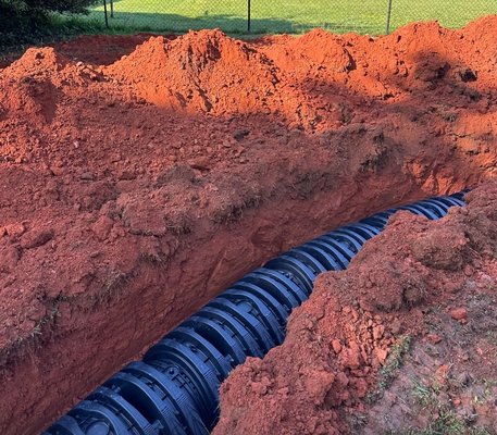 Replacing a drainfield - This drainfield had failed and we replaced the old drain lines with new high-capacity chamber drain lines as well as install a new tank. Call us if you think you're having drainfield issues before the whole system needs to be replaced! Replacing a drainfield - This drainfield had failed and we replaced the old drain lines with new high-capacity chamber drain lines as well as install a new tank. Call us if you think you're having drainfield issues before the whole system needs to be replaced!