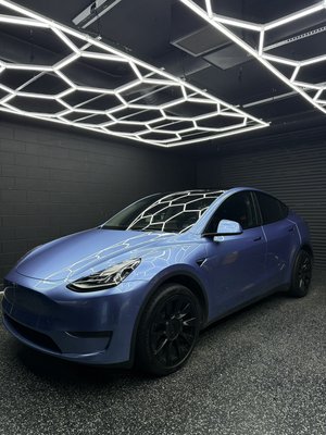 FULL BODY COLOR PPF - Tesla Model Y transformed from factory white to a deep, vibrant blue using color Paint Protection Film, delivering a true paint-like gloss while keeping the original finish fully protected underneath.
This premium color PPF provides a flawless, high-end appearance without repainting while shielding the vehicle from rock chips, light scratches, swirl marks, and road debris. The film features self-healing technology so minor blemishes disappear with heat, helping the finish stay looking fresh long term.
You get the best of both worlds: a bold new color change with durable, long-lasting protection and a finish that looks just like factory paint. FULL BODY COLOR PPF - Tesla Model Y transformed from factory white to a deep, vibrant blue using color Paint Protection Film, delivering a true paint-like gloss while keeping the original finish fully protected underneath.
This premium color PPF provides a flawless, high-end appearance without repainting while shielding the vehicle from rock chips, light scratches, swirl marks, and road debris. The film features self-healing technology so minor blemishes disappear with heat, helping the finish stay looking fresh long term.
You get the best of both worlds: a bold new color change with durable, long-lasting protection and a finish that looks just like factory paint.