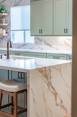 Kitchen Remodel - This stunning remodel was completed in just under one month, from start to finish! The Jade green cabinets created a warm and inviting ambiance, paired with purely elegant Calacatta Oro Lux quartz countertops transformed this space into a luxurious kitchen! Kitchen Remodel - This stunning remodel was completed in just under one month, from start to finish! The Jade green cabinets created a warm and inviting ambiance, paired with purely elegant Calacatta Oro Lux quartz countertops transformed this space into a luxurious kitchen!