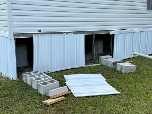 Perimeter Piers Fallen - Single Wide - This singlewide in Jacksonville only required a 1/2" lift, but the install crew hadn't properly graded the ground so EVERY perimeter pier had fallen over. The vinyl skirting was the only thing holding this home in place. We leveled the ground under the piers, rebuild and leveled every pier, and got this home in the best shape it's ever been in. Perimeter Piers Fallen - Single Wide - This singlewide in Jacksonville only required a 1/2" lift, but the install crew hadn't properly graded the ground so EVERY perimeter pier had fallen over. The vinyl skirting was the only thing holding this home in place. We leveled the ground under the piers, rebuild and leveled every pier, and got this home in the best shape it's ever been in.