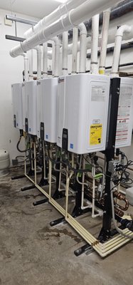 Tankless Water Heater Repair - Customer called with a failed Water Heater tank that serviced a hotel with over 80 rooms. We provided an efficient solution, replace existing tanks with (8) Navien NPE 240-A2 Tankless Water Heater. We factored in the minimal impact to current guests, fabricated a racked system before cutting off water to the building. Installed new fittings, new service valves, condensate lines, all completed within 2 days. Customer was pleased with the new system. If you are looking for a continuous hot water solution, a tankless water heater is the right choice. Tankless Water Heater Repair - Customer called with a failed Water Heater tank that serviced a hotel with over 80 rooms. We provided an efficient solution, replace existing tanks with (8) Navien NPE 240-A2 Tankless Water Heater. We factored in the minimal impact to current guests, fabricated a racked system before cutting off water to the building. Installed new fittings, new service valves, condensate lines, all completed within 2 days. Customer was pleased with the new system. If you are looking for a continuous hot water solution, a tankless water heater is the right choice.