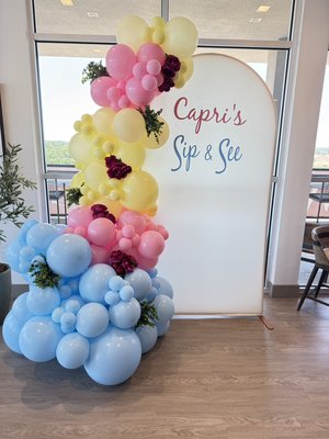 Setup for Capri’s Sip & See - A charming balloon setup in soft pastel tones — baby blue, blush pink, and light yellow — designed for a warm and joyful Sip & See celebration. The organic garland features a bubbly base, greenery, and deep magenta florals for contrast.
Paired with a backdrop and custom vinyl lettering, this design creates the perfect photo-ready corner to welcome a new little one into the world. Setup for Capri’s Sip & See - A charming balloon setup in soft pastel tones — baby blue, blush pink, and light yellow — designed for a warm and joyful Sip & See celebration. The organic garland features a bubbly base, greenery, and deep magenta florals for contrast.
Paired with a backdrop and custom vinyl lettering, this design creates the perfect photo-ready corner to welcome a new little one into the world.