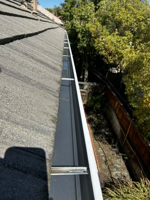 Rain Gutter Service - This is an example of a gutter clean job afterwards and ready for the rain to easily flow down!