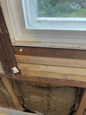Home Remodel/Repair - A wall was installed incorrectly with additional 2x4s stacked on both sides of the window, the 2x4s were used to install new dry wall that the previous tenant had destroyed. As well as insulation was left exposed causing the insulation to go bad. We took out the boards causing the lumping and installed new insulation as well as a brand new wall.