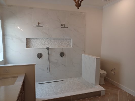 Transforming Bathrooms - From sleek, contemporary designs to classic, spa-like sanctuaries, our bathroom remodels combine style, comfort, and functionality. We handle everything—from custom tile work and walk-in showers to updated vanities and efficient lighting. Our attention to detail ensures every project is tailored to your needs, whether you’re renovating a powder room or creating a luxurious master bath oasis. Discover how we turn ordinary spaces into extraordinary bathrooms! Transforming Bathrooms - From sleek, contemporary designs to classic, spa-like sanctuaries, our bathroom remodels combine style, comfort, and functionality. We handle everything—from custom tile work and walk-in showers to updated vanities and efficient lighting. Our attention to detail ensures every project is tailored to your needs, whether you’re renovating a powder room or creating a luxurious master bath oasis. Discover how we turn ordinary spaces into extraordinary bathrooms!