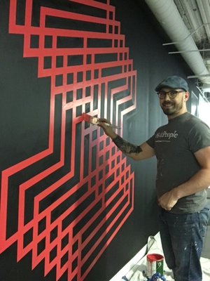 Mural de Iris Worldwide - While residential painting is our bread and butter, our Team of professionals are highly skilled and can take on anything painting related. This was a cool project we did for Iris Worldwide's commercial space in the loop. Thanks guys!