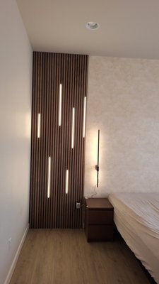 Wallpapering and installation of soundproofing panels. - Installation of soundproofing panels and wallpapering with pattern selection. Installation of LED strips with subsequent solution to hide wires under panels.