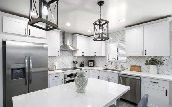 Air bnb Flip - This property was built in the 1960's & needed quite some work. We completely gutted it & upgraded this kitchen completely to serve as an air bnb rental. We had little time for this complete remodel of the home which took us a month for roughly 1,200 sq ft. We had to demo (which involved soffit removal in kitchen), redo electrical, floors through out, two bathrooms, paint, plumbing, counter tops, cabinets, etc.