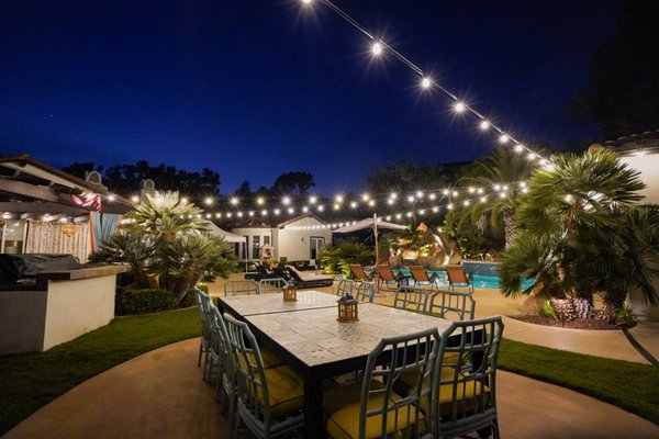 Backyard Oasis w/ LED Cafe Lights - This project was rather technical but a lot of fun and WOW, what a difference some well placed lighting makes. The backyard pool area was essentially dark and did not facilitate night time use. Our installation transformed this residence into a user friendly night time oasis. Offered as an Air B n B rental part of the year, the homeowner featured photos of the outdoor living space and bookings significantly increased. Backyard Oasis w/ LED Cafe Lights - This project was rather technical but a lot of fun and WOW, what a difference some well placed lighting makes. The backyard pool area was essentially dark and did not facilitate night time use. Our installation transformed this residence into a user friendly night time oasis. Offered as an Air B n B rental part of the year, the homeowner featured photos of the outdoor living space and bookings significantly increased.