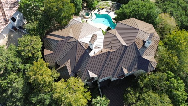 Tile-to-Metal Roof Replacement – San Antonio, TX - This project highlights a full roof replacement in San Antonio, TX, where our team removed an aging clay tile roof and upgraded it to a sleek, standing seam metal system. The old tile roof had cracked and shifted over time, leaving the home vulnerable to leaks, high energy costs, and ongoing maintenance.
We completed a careful tear-off, inspected and repaired the decking, and installed a durable metal roof designed to last for decades. Standing seam metal provides excellent resistance to Texas heat, wind, and hail while giving the home a modern, upscale look. The result is a roof that improves curb appeal, lowers long-term maintenance, and is backed by a manufacturer warranty.
Rooftop Roofing and Remodeling LLC serves homeowners in San Antonio, Schertz, New Braunfels, Selma, Cibolo, Universal City, Converse, Live Oak, and Garden Ridge with expert roofing, remodeling, and exterior upgrades. Our services include roof replacement, roof repair, patio covers, pergolas, fencing, siding, windows, and interior remodeling. Tile-to-Metal Roof Replacement – San Antonio, TX - This project highlights a full roof replacement in San Antonio, TX, where our team removed an aging clay tile roof and upgraded it to a sleek, standing seam metal system. The old tile roof had cracked and shifted over time, leaving the home vulnerable to leaks, high energy costs, and ongoing maintenance.
We completed a careful tear-off, inspected and repaired the decking, and installed a durable metal roof designed to last for decades. Standing seam metal provides excellent resistance to Texas heat, wind, and hail while giving the home a modern, upscale look. The result is a roof that improves curb appeal, lowers long-term maintenance, and is backed by a manufacturer warranty.
Rooftop Roofing and Remodeling LLC serves homeowners in San Antonio, Schertz, New Braunfels, Selma, Cibolo, Universal City, Converse, Live Oak, and Garden Ridge with expert roofing, remodeling, and exterior upgrades. Our services include roof replacement, roof repair, patio covers, pergolas, fencing, siding, windows, and interior remodeling.