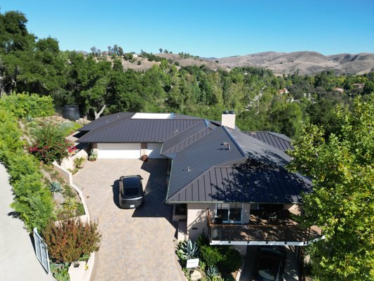 Standing Seam Metal Roof - Our metal roof installation projects are designed to deliver a perfect blend of durability, modern style, and long-term protection for your home. Each project begins with a thorough assessment of the existing roof structure to ensure proper preparation and a secure foundation for the new roofing system. High-quality metal panels are then carefully installed using precision techniques that provide superior weather resistance, energy efficiency, and long-lasting performance.

Metal roofing is an excellent investment for homeowners looking to enhance both the appearance and value of their property. With its sleek design, exceptional durability, and low maintenance requirements, a professionally installed metal roof offers reliable protection against harsh weather while maintaining its beauty for decades. Our team focuses on craftsmanship, safety, and attention to detail to ensure every installation meets the highest standards and exceeds customer expectations.

Standing Seam Metal Roofs SMI 1.5” Snap Lock 450 + Panels with High Temperature Peel & Stick Underlayment 

Benefits homeowners love:
    •    Long-lasting protection (often 40–70 years)
    •    Energy-efficient and reflective materials
    •    Modern, high-end curb appeal
    •    Low maintenance compared to traditional roofing
    •    Excellent resistance to wind, rain, and fire