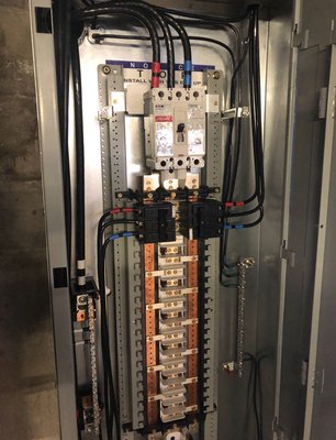 EV power panel - This project was done in a commercial parking garage. Management planned on adding some electric vehicle charging stations in the parking area and needed a new source power to supply these large loads.