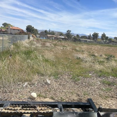 Land Clean Up - The land has dead weeds before and after I the land is flat dirt and cleaned up.