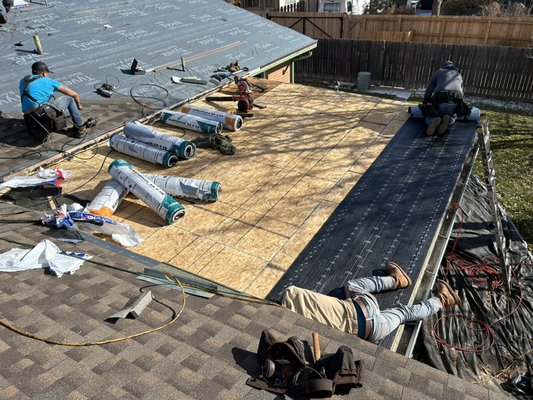 Residential roof replacement - We removed the damaged roof and found that the porch roof had inferior decking. We installed new decking and a new complete roof system. Another satisfied customer and relationship.
