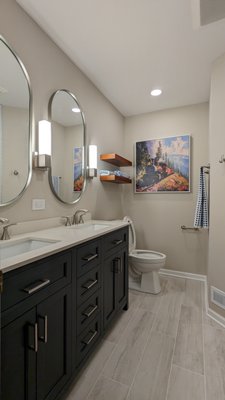 Wheaton (2) Bathroom(s) Renovation - Just completed, renovation of two bathrooms for a repeat client from many years ago after a kitchen project. Total gut of two bathroom(s) (2nd floor hall & basement). Existing bathrooms where in dire need of and remodel. New bathrooms came out looking stunning as always!
It was a total gut of both bathrooms.. Added expanded recessed nitches, new lighting layout, custom fabricated countertop w/floating vanity and extended banjo top over toilet, custom fabricated shower doors. Wheaton (2) Bathroom(s) Renovation - Just completed, renovation of two bathrooms for a repeat client from many years ago after a kitchen project. Total gut of two bathroom(s) (2nd floor hall & basement). Existing bathrooms where in dire need of and remodel. New bathrooms came out looking stunning as always!
It was a total gut of both bathrooms.. Added expanded recessed nitches, new lighting layout, custom fabricated countertop w/floating vanity and extended banjo top over toilet, custom fabricated shower doors.