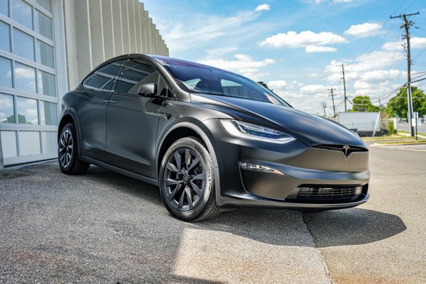 2022 Tesla Model X Matte PPF - The Gloss Black 2022 Tesla Model X has undergone a comprehensive overhaul, featuring LLumar Matte Paint Protection Film, Gyeon Platinum Package ceramic coating, and LLumar Stratos window tint. This transformative process not only enhances the vehicle's aesthetic appeal but also ensures robust protection by reducing glare, heat, and adding UV protection. The Model X emerges from this meticulous treatment as a refined masterpiece, seamlessly combining style and safeguarding measures for an elevated driving experie 2022 Tesla Model X Matte PPF - The Gloss Black 2022 Tesla Model X has undergone a comprehensive overhaul, featuring LLumar Matte Paint Protection Film, Gyeon Platinum Package ceramic coating, and LLumar Stratos window tint. This transformative process not only enhances the vehicle's aesthetic appeal but also ensures robust protection by reducing glare, heat, and adding UV protection. The Model X emerges from this meticulous treatment as a refined masterpiece, seamlessly combining style and safeguarding measures for an elevated driving experie
