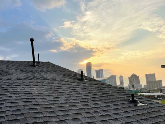 Roofing Elevation: Bridging Aesthetics and Functionality Amidst Houston's Skyline - Elevating Architecture and Views: Feast your eyes on our latest project, where innovation meets panoramic beauty! We had the privilege of replacing the roofs of a stunning home featuring a unique skillion and butterfly roof designs, creating a striking visual contrast. As the sun sets over downtown Houston, with the iconic Minute Maid Stadium in view, our craftsmanship shines as brilliantly as the city lights. This project resents roofing as both an art and a science, showcasing our dedication to marrying sound roofing science with beautiful design. Roofing Elevation: Bridging Aesthetics and Functionality Amidst Houston's Skyline - Elevating Architecture and Views: Feast your eyes on our latest project, where innovation meets panoramic beauty! We had the privilege of replacing the roofs of a stunning home featuring a unique skillion and butterfly roof designs, creating a striking visual contrast. As the sun sets over downtown Houston, with the iconic Minute Maid Stadium in view, our craftsmanship shines as brilliantly as the city lights. This project resents roofing as both an art and a science, showcasing our dedication to marrying sound roofing science with beautiful design.