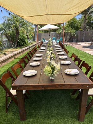 Outdoor Wedding Rustic Farm Tables - Outdoor Setup Rustic Farm Tables with Brown fruitwood folding chairs with padding. Outdoor Wedding Rustic Farm Tables - Outdoor Setup Rustic Farm Tables with Brown fruitwood folding chairs with padding.