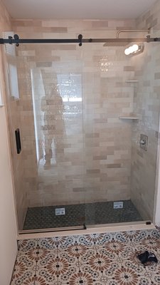 Shower conversion - We tore out the existing tub and converted it into a shower and installed new wall tile and inside and outside floor tile Shower conversion - We tore out the existing tub and converted it into a shower and installed new wall tile and inside and outside floor tile
