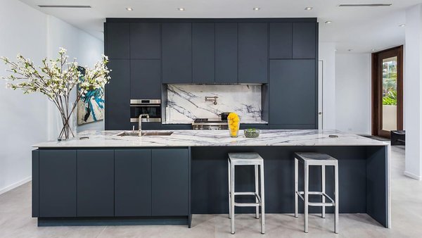 Culver City Kitchen Remodel - Modern Kitchen + Dining Remodel
This stunning kitchen and dining space remodel by Tempo Construction showcases our signature blend of precision, efficiency, and elevated design. Matte charcoal cabinetry contrasts beautifully with bold-veined marble countertops and backsplash, while custom paneling hides appliances for a seamless finish.
The spacious island, equipped with integrated storage and sleek hardware, is perfect for entertaining or everyday living. Clean lines, soft under-cabinet lighting, and modern fixtures complete the look—offering both luxury and function.
The adjacent dining area features a solid wood table paired with modern chairs and warm accents, creating a cohesive flow throughout the open-plan layout. Pops of greenery and floral arrangements add a personal, welcoming touch.
At Tempo Construction, we bring bold ideas to life—on time, on budget, and with craftsmanship you can see in every detail.
Love this look? Let’s bring it to your home. Contact Tempo Construction today for a free consultation. Culver City Kitchen Remodel - Modern Kitchen + Dining Remodel
This stunning kitchen and dining space remodel by Tempo Construction showcases our signature blend of precision, efficiency, and elevated design. Matte charcoal cabinetry contrasts beautifully with bold-veined marble countertops and backsplash, while custom paneling hides appliances for a seamless finish.
The spacious island, equipped with integrated storage and sleek hardware, is perfect for entertaining or everyday living. Clean lines, soft under-cabinet lighting, and modern fixtures complete the look—offering both luxury and function.
The adjacent dining area features a solid wood table paired with modern chairs and warm accents, creating a cohesive flow throughout the open-plan layout. Pops of greenery and floral arrangements add a personal, welcoming touch.
At Tempo Construction, we bring bold ideas to life—on time, on budget, and with craftsmanship you can see in every detail.
Love this look? Let’s bring it to your home. Contact Tempo Construction today for a free consultation.