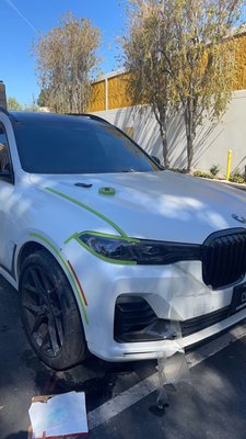 BMW X5 - Thousand Oaks, CA - New Level worked on this BMW X5 - it had scratches and dents on the front bumper and fenders. Call us now for an estimate! Let us make your vehicle look brand new again.
