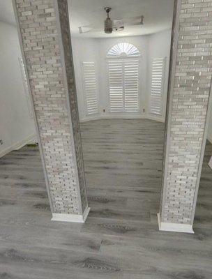 Unique home done in brand new waterproof flooring with new baseboards. - This home was remodeled, and we had the honor of adding gorgeous waterproof flooring and new baseboards throughout. Our client was thrilled with how our installers completed this job!