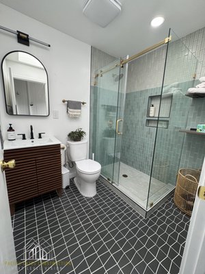 Bathroom Remodel | Alameda, CA - Bathroom Remodel – Alameda, CA
This bathroom in Alameda, CA was completely remodeled and expanded into a full, functional space. We relocated the layout and added a walk-in shower to improve flow and comfort, aiming for a design that feels welcoming, modern, minimal and family-friendly.
Design Highlights:
- Soft green vertical shower tiles with white flooring
- Black tile for the main bathroom floor
- Corner shelving for added storage
- Modern, minimalist sink
- Gold hardware for a touch of elegance
The final result is a clean, unique bathroom that balances simplicity with thoughtful design. Bathroom Remodel | Alameda, CA - Bathroom Remodel – Alameda, CA
This bathroom in Alameda, CA was completely remodeled and expanded into a full, functional space. We relocated the layout and added a walk-in shower to improve flow and comfort, aiming for a design that feels welcoming, modern, minimal and family-friendly.
Design Highlights:
- Soft green vertical shower tiles with white flooring
- Black tile for the main bathroom floor
- Corner shelving for added storage
- Modern, minimalist sink
- Gold hardware for a touch of elegance
The final result is a clean, unique bathroom that balances simplicity with thoughtful design.