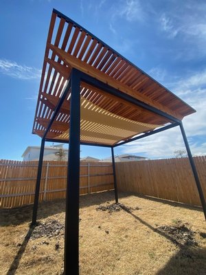 Pergolas & Shade Structures - One of the most significant advantages of custom pergolas and shade structures is the ability to create a comfortable outdoor space that shields you from the harsh elements. Whether you're seeking respite from the scorching sun or protection from light rain, these structures provide you with the perfect shady retreat. With the addition of retractable canopies or curtains, you have full control over the amount of shade or sunlight you desire, making your outdoor experience both customizable and enjoyable. Pergolas & Shade Structures - One of the most significant advantages of custom pergolas and shade structures is the ability to create a comfortable outdoor space that shields you from the harsh elements. Whether you're seeking respite from the scorching sun or protection from light rain, these structures provide you with the perfect shady retreat. With the addition of retractable canopies or curtains, you have full control over the amount of shade or sunlight you desire, making your outdoor experience both customizable and enjoyable.