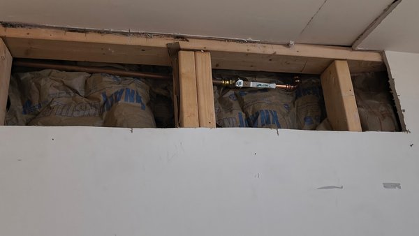 Drywall repair - We repair damaged drywall and install a properly sized access panel to allow future access to hose bib shut off.