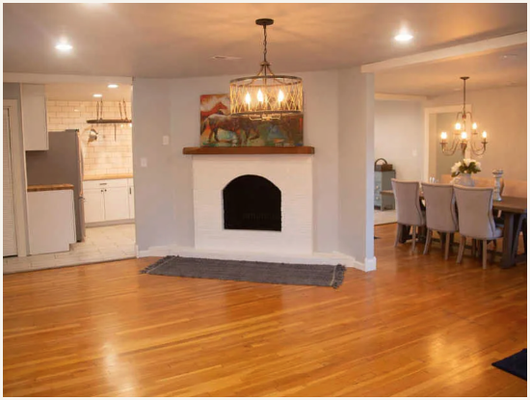 Fireplace Renovation - This originally was an unattractive brick rectangular fireplace.  Post renovation, the arched look added character as a center piece for the home.