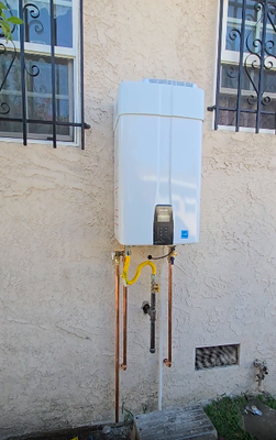 Tankless Water Heater - A compact, wall-mounted unit that heats water instantly as it flows through, providing an endless, on-demand supply without a storage tank. Tankless Water Heater - A compact, wall-mounted unit that heats water instantly as it flows through, providing an endless, on-demand supply without a storage tank.