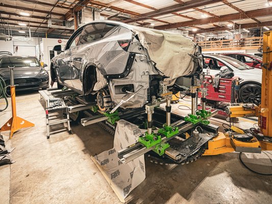 Frame Repairs - Factory-accurate repairs begin on the jig Frame Repairs - Factory-accurate repairs begin on the jig