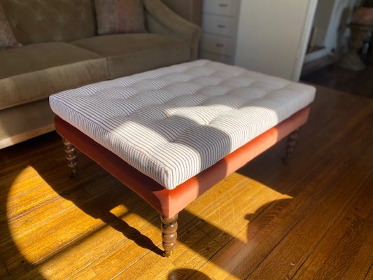 Custom Ottoman - Custom ottoman with alder hardwood frame, biscuit tufted buttons, bobbin legs & casters.