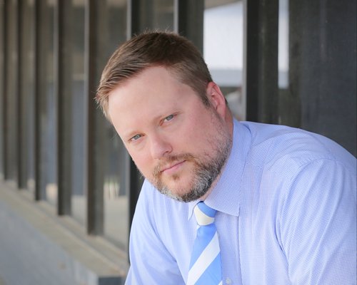 James Dutton - Born and raised in Griffin, James is deeply invested in his community. He understands the importance of getting into the trenches with his clients to advocate strongly for them.

James entered Gordon State College at age 15, completed an associate degree in business, and then spent the next two years traveling the world as a missionary, meeting people from 93 different countries. Upon returning to Georgia, James earned a bachelor’s degree in international economics in 2010, a master’s degree in public policy in 2013, a JD from Georgia State University College of Law in 2014. If he ever gets time to pursue a Ph.D., James says it will be an economics-based solution to the rainforest crisis.

Courted by many of the major law firms in Atlanta, James turned them all down to move back to Griffin and become a Spalding County public defender. James says of his decision: “God has blessed me with all these amazing things. He wants me to use my time and talents to come back to my little town and help the people that live here to make it a better place, so that’s what I’m doing.”

Not one to give up easily, James has defended over 1,600 clients in front of 114 judges and has lost only two trials. After leaving the Griffin Circuit Public Defenders Office in 2016 to start his own law firm, James and his mother, Debra Dutton, joined forces to establish Dutton & Dutton Law Firm, LLC, in May 2020.