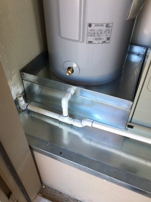 New Water Drain Pan - We replaced the failing drain pan with a custom-fit solution built specifically for this tight utility space. The new pan is securely set, properly drained, and sized to support the water heater safely—an example of the detailed, problem-solving craftsmanship our clients trust. New Water Drain Pan - We replaced the failing drain pan with a custom-fit solution built specifically for this tight utility space. The new pan is securely set, properly drained, and sized to support the water heater safely—an example of the detailed, problem-solving craftsmanship our clients trust.